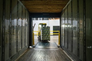 Truck delivering at industrial ramp